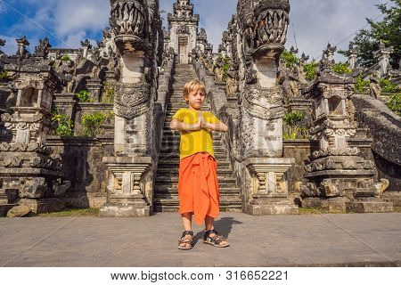Boy Tourist On Background Of Three Stone Ladders In Beautiful Pura Lempuyang Luhur Temple. Paduraksa