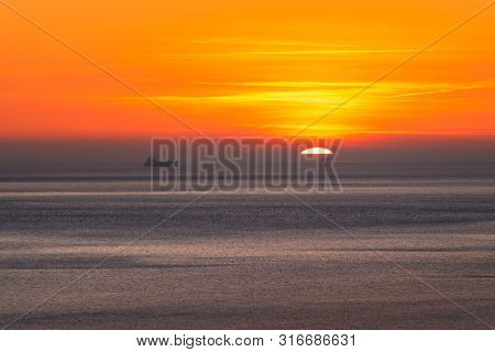 Sunset Over The Sea Horizon Nature Landscape. Red Clouds And Sea Landscape. Sea Nature In Sunset. Na