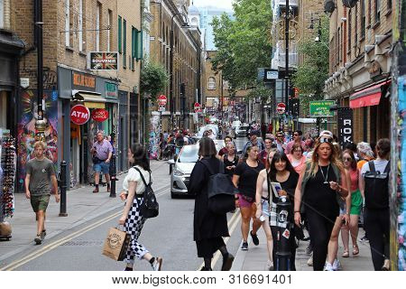 London, Uk - July 13, 2019: People Visit Brick Lane Street In Shoreditch District Of London. Shoredi