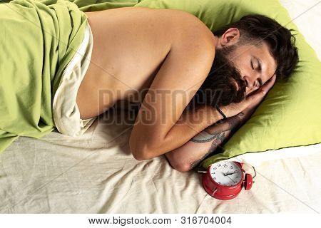 Man Lying In Bed And Sleeping. Man Bearded Hipster Having Problems With Sleep. Bearded Man Sleeping 