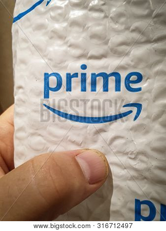 Tel-aviv, August 2019: Amazon Prime Mail Envelope For Small Shopping Inside Mailbox