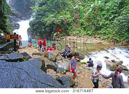 Chantaburi, Laem Sing, Thailand - 26 July 2019 : Tourists Swimming  In Waterfall At Namtokphlio Nati