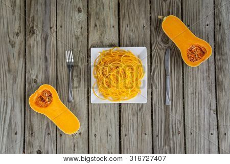 Top View Of Butternut Squash With Fork And Knife. Ready To Eat