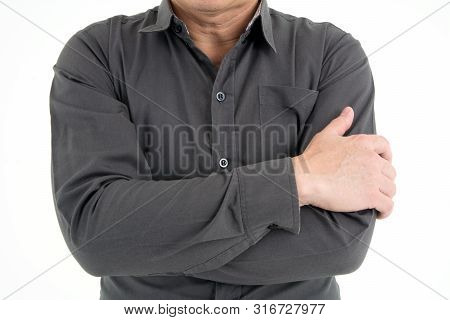 Portrait Of Businessman Cross Hand In Dark Brwon Shirt To Show Confidence Isolated On White Backgrou
