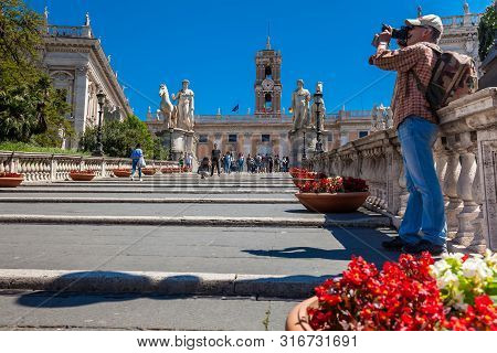 Rome, Italy - April, 2018: Tourists Visiting The Capitoline Hill And The Palazzo Senatorio