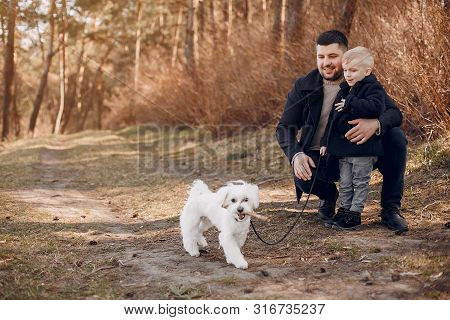 Cute Family Playing In A Summer Park