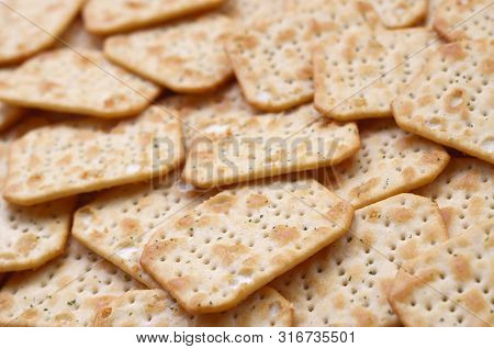 Tuc Original Snack Crackers Lies On Market Table Stacked In Big Pile