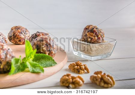 Vegetarian Food, Energy Balls Of Walnuts, Dates, Prunes, Cranberries, Honey With Sesame