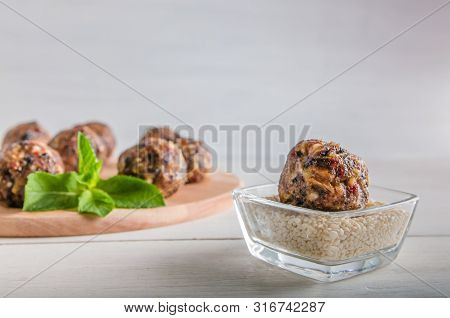 Vegetarian Food, Energy Balls Of Walnuts, Dates, Prunes, Cranberries, Honey With Sesame