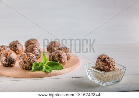 Vegetarian Food, Energy Balls Of Walnuts, Dates, Prunes, Cranberries, Honey With Sesame