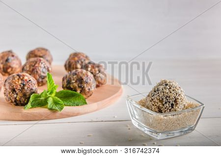 Vegetarian Food, Energy Balls Of Walnuts, Dates, Prunes, Cranberries, Honey With Sesame