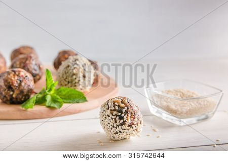 Vegetarian Food, Energy Balls Of Walnuts, Dates, Prunes, Cranberries, Honey With Sesame