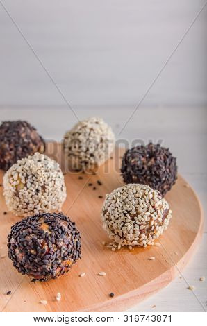 Vegetarian Food, Energy Balls Of Walnuts, Dates, Prunes, Cranberries, Honey With Sesame