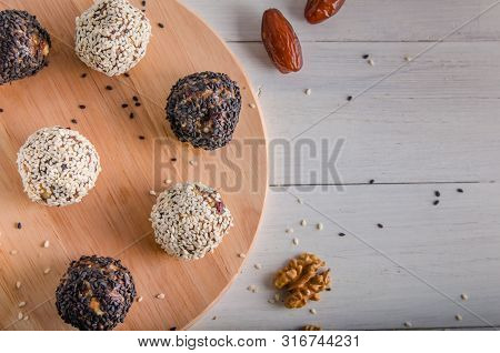 Vegetarian Food, Energy Balls Of Walnuts, Dates, Prunes, Cranberries, Honey With Sesame