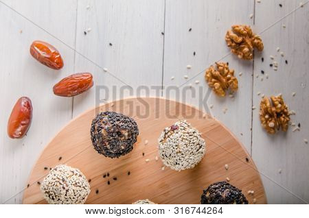 Vegetarian Food, Energy Balls Of Walnuts, Dates, Prunes, Cranberries, Honey With Sesame
