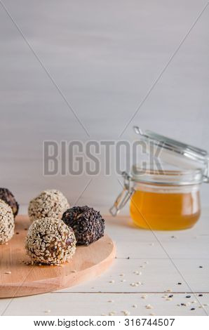 Vegetarian Food, Energy Balls Of Walnuts, Dates, Prunes, Cranberries, Honey With Sesame