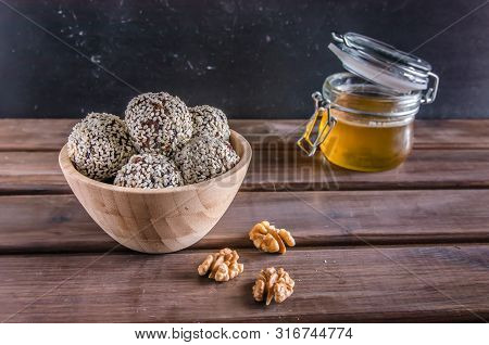 Vegetarian Food, Energy Balls Of Walnuts, Dates, Prunes, Cranberries, Honey With Sesame
