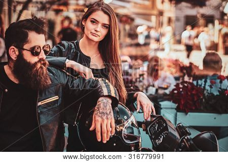 Beautiful Couple With Brutal Biker And His Sexy Gilfriend Are Chilling Near Cefeteria With Motorbike