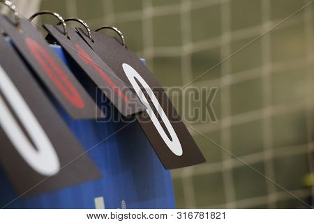 Young Boy Turns Number On Abacus In A Volleyball Match. Determining The Score. Tournament Recorder. 