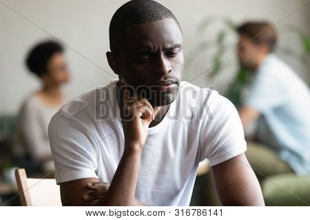 Unhappy Black Male Loner Feel Hurt Sitting Alone