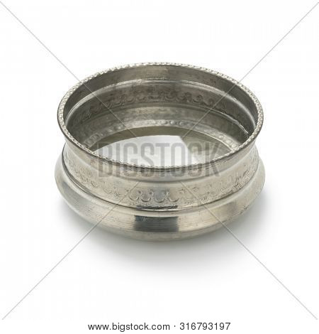Single silvercolored metal Hammam water bowl with decoration filled with water isolated on white background
