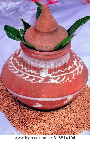 Clay Pitcher Jar Placed On A Pile Of Wheat_indian Tradition