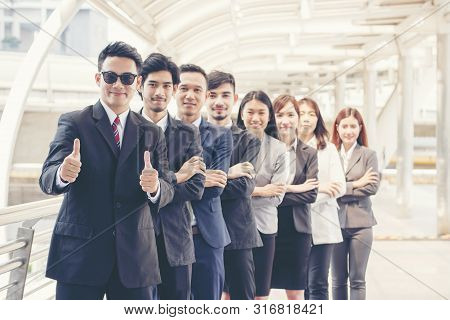 Business Partners Giving Thumbs Up After Complete A Deal To Show Potential Of Leadership With Corpor