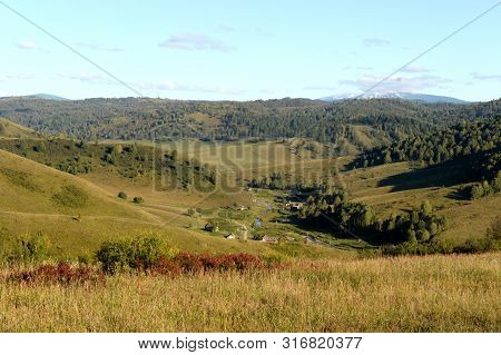 Taiga Village Generalka In The Mountains Of Altai Krai. Western Siberia. Russia