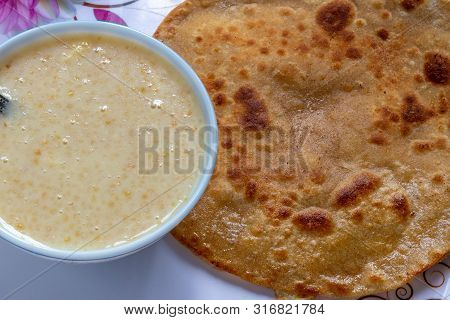 Egg Paratha With Dalia Or Daliya, Cereal Food Know As Bulgur Cooked In Milk Served With Egg Stuffed 