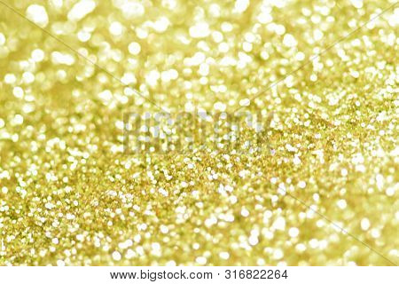 Gold Bokeh Texture. Festive Glitter Background With Defocused Lights