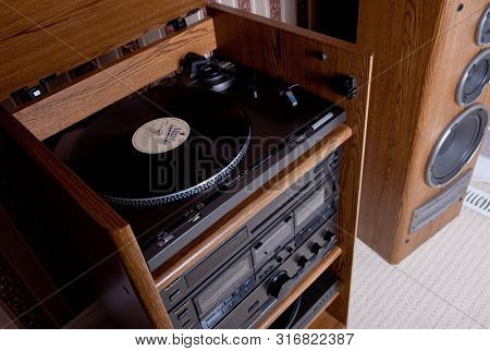 Technics Turntable in the tower rack of audio stereo components