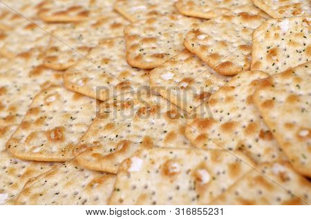 Tuc Original Snack Crackers Lies On Market Table Stacked In Big Pile