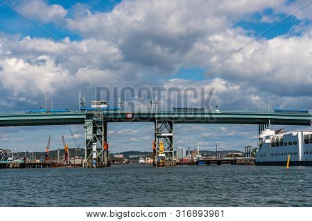 Summer Seascape View Of Gota Alvbron In Gothenburg Sweden. Traffic Bridge With Buses And Ships Again