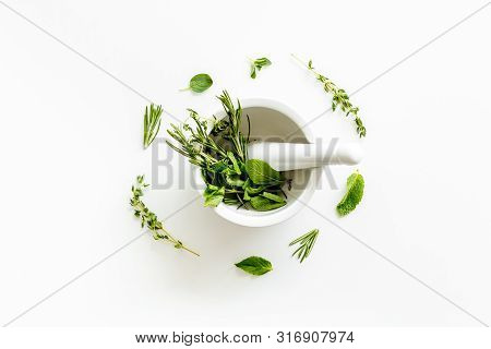 Alternative Medicine With Medicinal Herbs On White Background Top View