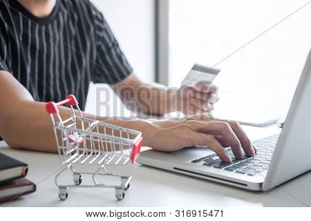 Image Of Young Man Using Smartphone For Online Shopping Website And Pay By Credit Card, Online Payme