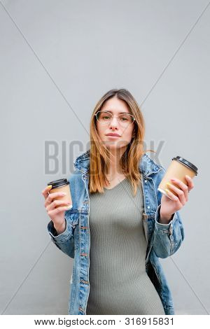 Blonde Girl With Paper Cups Of Coffee On Grey