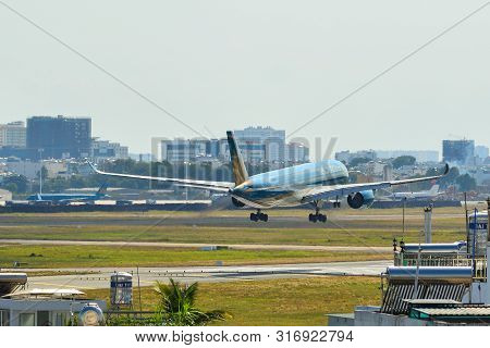 Passenger Airplane Landing At Saigon Airport
