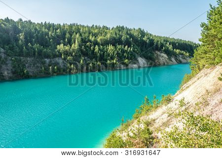 Panorama Of Chalkpit On Limestone Coast Of Huge Turquoise Lake Or River Near Forest. Chalk Quarry Fi