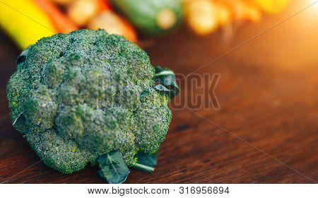 Fresh Salubrious Colourful Vegetables On Wooden Background, Broccoli In Focus, Potatoes, Carrots, Zu