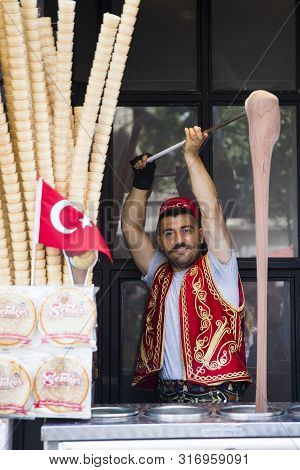 Istanbul, Turkey - June 15, 2019: Unidentified Seller Of Turkish Ice Cream At Istanbul, Turkey. Trad