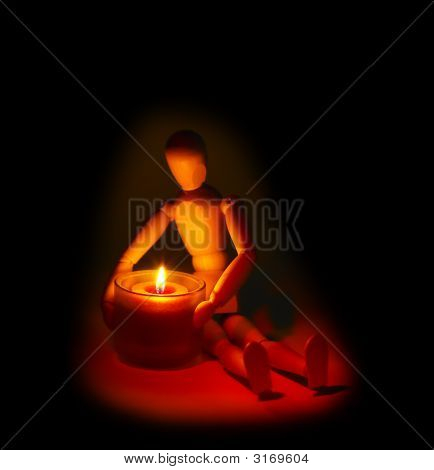 Dřevěný manekýn a svíčka