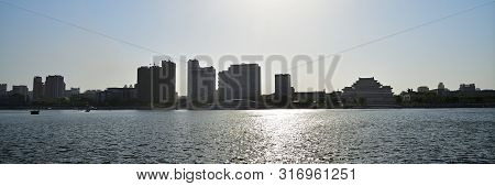 Pyongyang, North Korea -  May 1, 2019: Skyline And Taedong River In The Sunset. View On Modern Resid