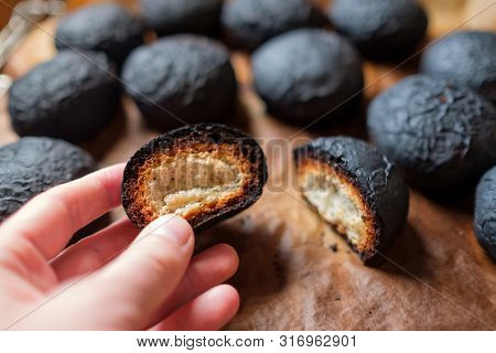 Several Spoiled Burnt Black Bread. Charred Food.
