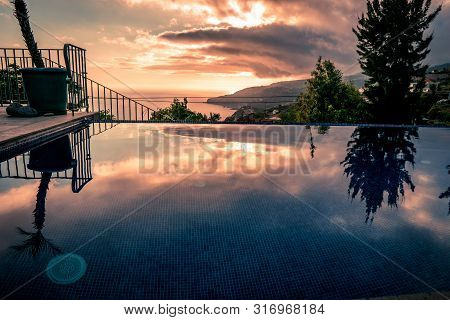 Sunset Water Reflections At Infinity Swimming Pool, Moody Tones