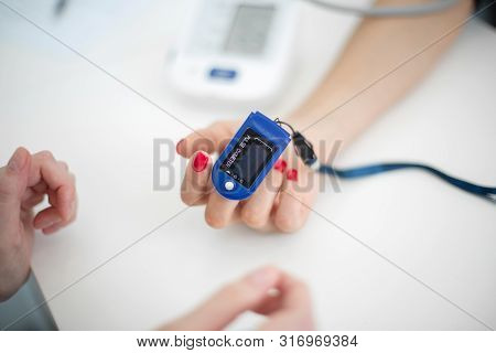 The Sensor Measuring The Pulse And Oxygen In The Blood On The Finger.