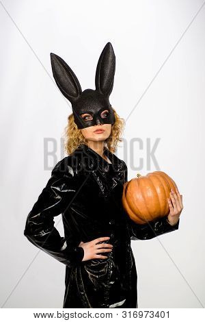 Serious Woman In Bunny Mask With Pumpkin. Sexy Girl In Halloween Party. Woman In Bunny Mask With Jac