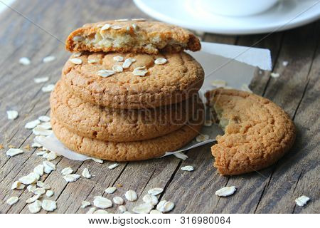 Homemade Oatmeal Cookies On An Old Wooden Table, Rustic Style. Oatmeal And Cinnamon Sticks. Copy Spa