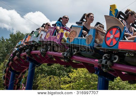 Orlando, Florida. August 07, 2019. People Enjoying Super Grovers Box Car Derby. It Is A Family Frien