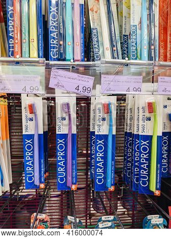 Tivat, Montenegro - 29 July 2020: Curaprox Toothbrushes Hang In A Shop Window In A Supermarket.