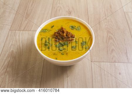 Indian Cuisine Kadhi - Vegetarian Curry Made Of Buttermilk And Chick Pea Flour. Served In A Bowl Or 